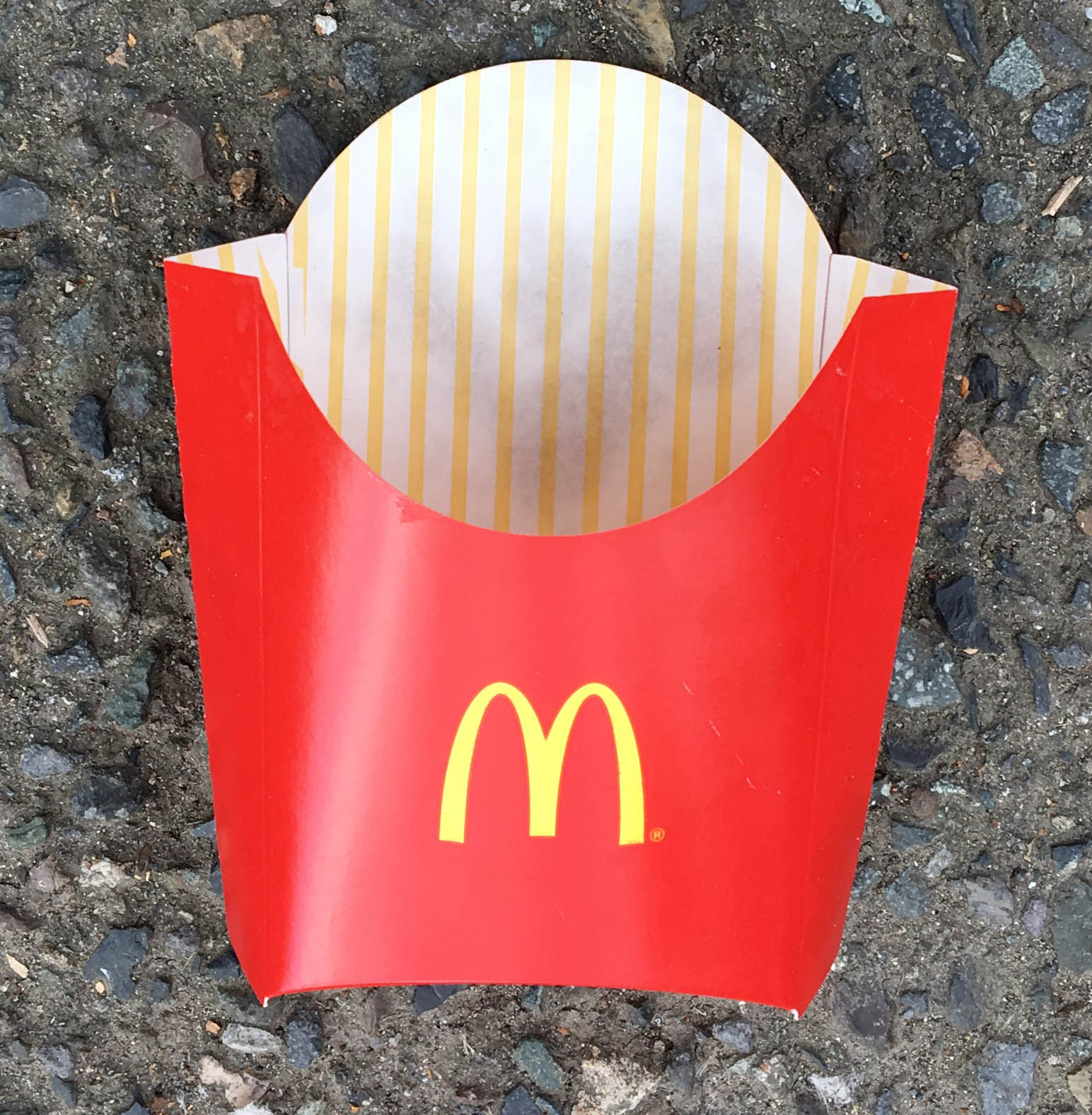 McDonalds French Fry Container Laying in the Parking Lot